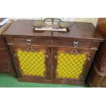 A late 19th Century rosewood chiffonier with frieze drawer and two metal grill lattice doors