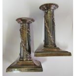 A pair of silver dwarf candlesticks