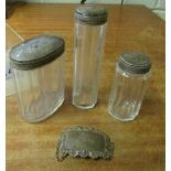 Three silver top jars and wine label