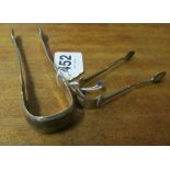 A pair of silver (Edinburgh 1827) sugar tongs maker AW and another pair (Birmingham 1898) maker WD