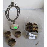 A set of nine brass napkin rings set semi-precious stones, another with bird design and a metal