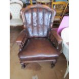 A mahogany frame brown leather chair