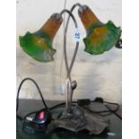 A Tiffany Medya table lamp with two flowerhead shades on lily pad base