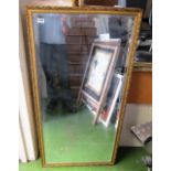 A large gilt framed wall mirror