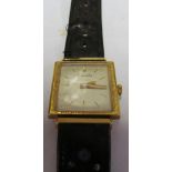An 18ct gold square faced ladies Nivada watch