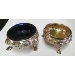 A pair of embossed silver salts (one blue liner)