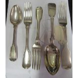 Three silver table forks including a Dublin one, a dessert spoon and table spoon