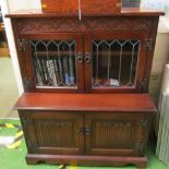 A similar low bookcase cupboard