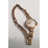 A 9ct gold Rotary ladies watch on 9ct strap