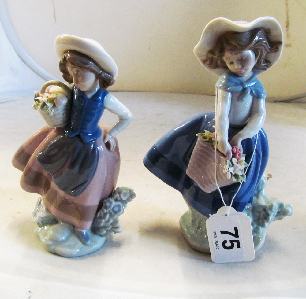 Two Lladro girls with baskets of flowers