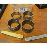 Three silver napkin rings, plated napkin, silver penknife and another penknife