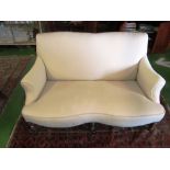 A two seater settee on turned legs