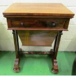A William IV rosewood worktable with fold over swivel red baize top and storage box (warped top)