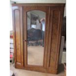 A Victorian walnut mirror door wardrobe