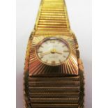 A 9ct gold ladies Nivada watch graduated gold strap 34.1g all in, in a blue Buchereri case