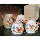 A three-piece fox hunting teaset and a similar biscuit barrel (a/f)