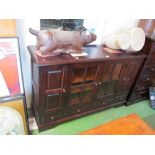 A Japanese stained birch sideboard with two glazed central doors flanked by two cupboard doors above