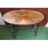 A 19th Century walnut inlaid oval table twin legs with stretcher