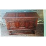 A carved oak coffer