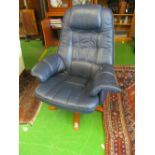 A blue leather upholstered armchair