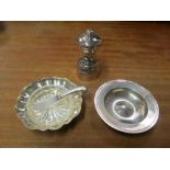 A silver pepper mill, dish, butter dish with glass liner and a knife