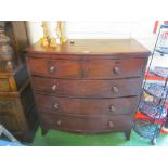 A mahogany bowfronted chest of two short and three long drawers (missing back leg and split to top)