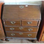 A small 19th Century bureau two short and two long drawers