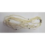 A multi strand pearl necklace with silver clasp