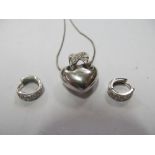 An 18ct white gold and white stone heart shaped necklace and a pair of similar earrings