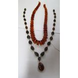 Two amber bead necklaces