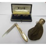 A pair of intaglio cufflinks man's head, silver and mother of pearl penknife and a miser's purse