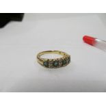 A 9ct gold ten stone diamond and green stone ring 3gm, size O