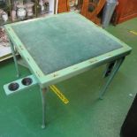 A folding card table green lacquer chinoiserie style with corner counter wells