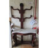 A Victorian mahogany marble top hall stand with shaped coat rack