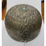 An eastern white metal dome shaped hinged box embossed foliate design with turquoise stone
