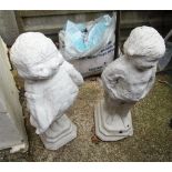 Two white painted garden statues girl and boy