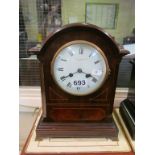 An Edwardian mahogany and satinwood strung mantle clock inscribed Stewart Dawson & Co Ltd on dial