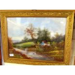 A Victorian oil country lane with cottage in gilt frame
