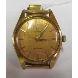 An Omega Sea master watch with gold coloured textured face on gilt stainless steel strap
