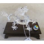 A Swarovski crystal Chinese dragon with ball on stand