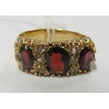 A 9ct gold ring set red and white stones Size W