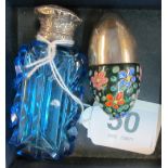 A blue glass scent bottle with white metal lid and another egg shaped scent bottle