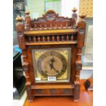 A late Victorian Aesthetic Movement clock brass dial with cherub spandrels, eight day striking