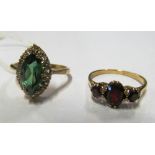 A 9ct gold ring set green and white stones and a garnet ring