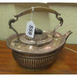 A silver fluted teapot