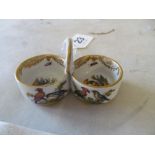 A Dresden small two section condiment with central handle decorated birds and insects