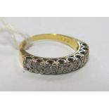 An 18ct gold illusion set half-hoop eternity ring size K