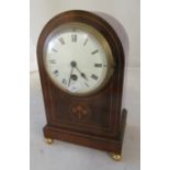 An Edwardian mahogany clock, dome top and eight day movement