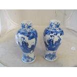 A pair of 19th Century Chinese blue and white vases decorated geisha and a man seated at a table,