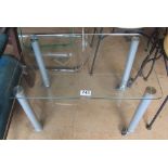 A two tier clear glass low table
